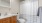 bathroom with a large mirror